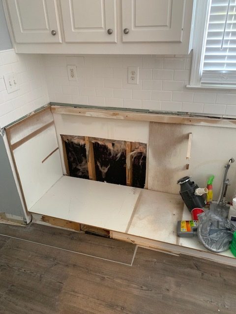 Water Damage behind kitchen cabinets